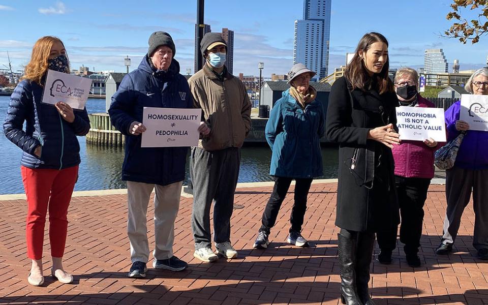 Sarah Pearson, in black coat, was part of a group of sex abuse survivors who called on U.S. bishops, in a Nov. 16 press conference in Baltimore, to focus less on who can take Communion and instead do more about sex abuse.