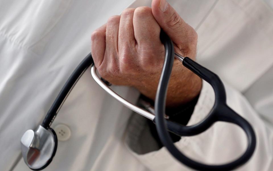 A doctor holds a stethoscope in this illustration photo. (CNS/Reuters/Regis Duvignau)