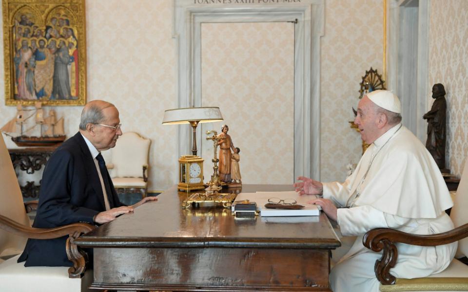 Pope Francis speaks with Lebanese President Michel Aoun during a private meeting at the Vatican March 21, 2022. Aoun tweeted April 5 that the nuncio has informed him Pope Francis is looking to visit the country in June. (CNS/Vatican Media via Reuters)