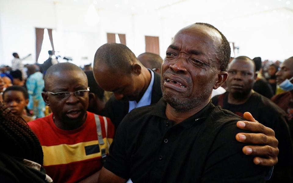 A man cries during a funeral Mass in the parish hall of St. Francis Xavier Church in Owo, Nigeria, June 17. The Mass was for at least 50 victims killed in a June 5 attack by gunmen during Mass at the church. (CNS/Reuters/Temilade Adelaja)