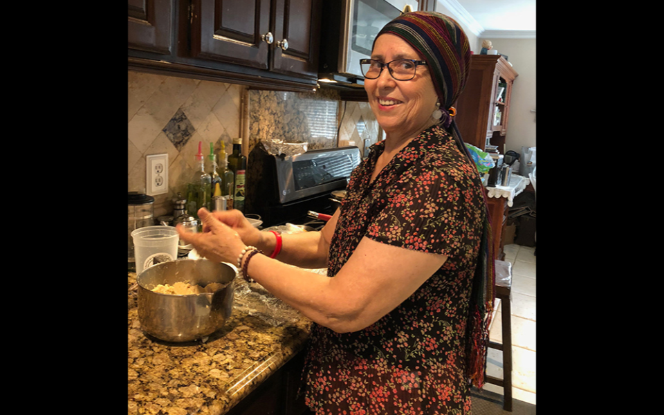 Maria de la Luz Arellano Miranda, Gustavo Arellano's mother, cooks gorditas for her family in 2018. She passed away a week after Easter four years ago from ovarian cancer at 69. (Courtesy of the Arellano family)