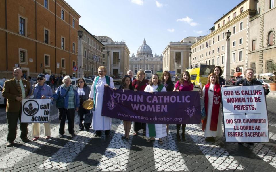 Group protests near Vatican, They carry signs supporting women's ordination,