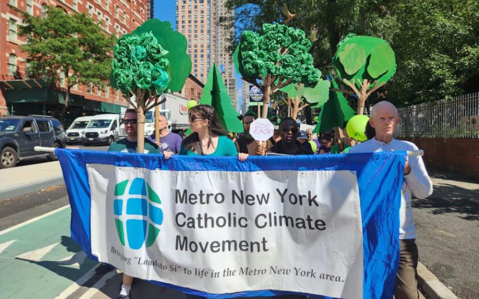 Participants with the banner of the Metro New York Catholic Climate Movement
