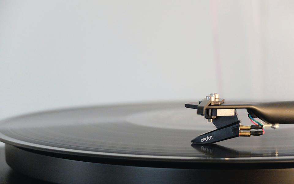 A record player is seen in a closeup photo. (Unsplash/Adrian Korte)