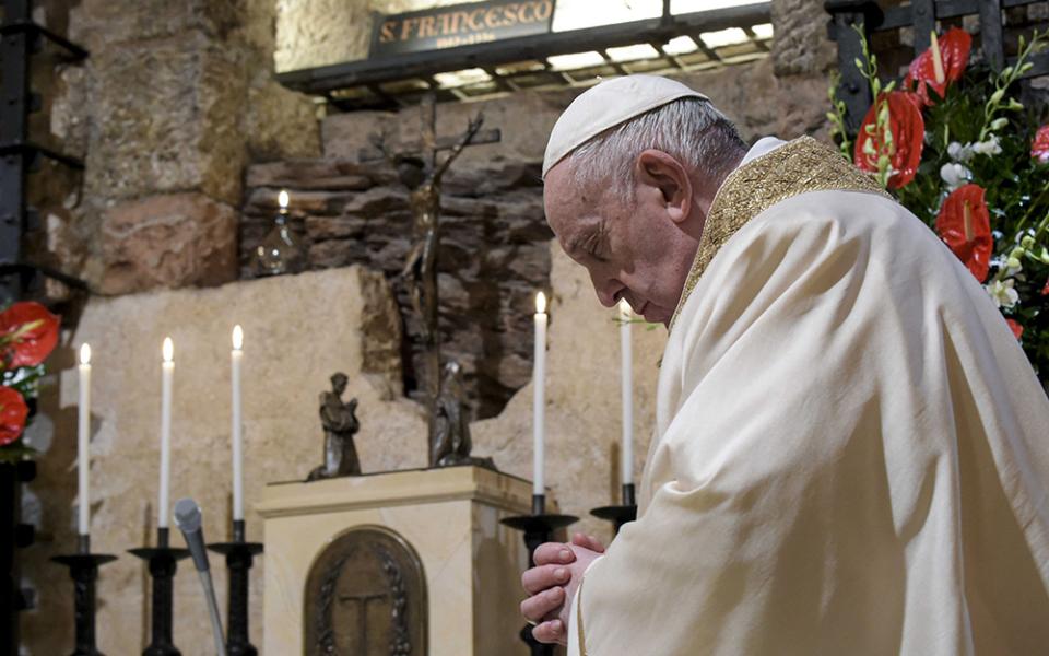 Pope Francis celebrates Mass at the tomb of St. Francis in the crypt of the Basilica of St. Francis Oct. 3, 2020, in Assisi, Italy. The pope signed his encyclical "Fratelli Tutti" at the end of the Mass. Francis makes "A Better Kind of Politics" the subject of an entire chapter. (CNS/Vatican Media)