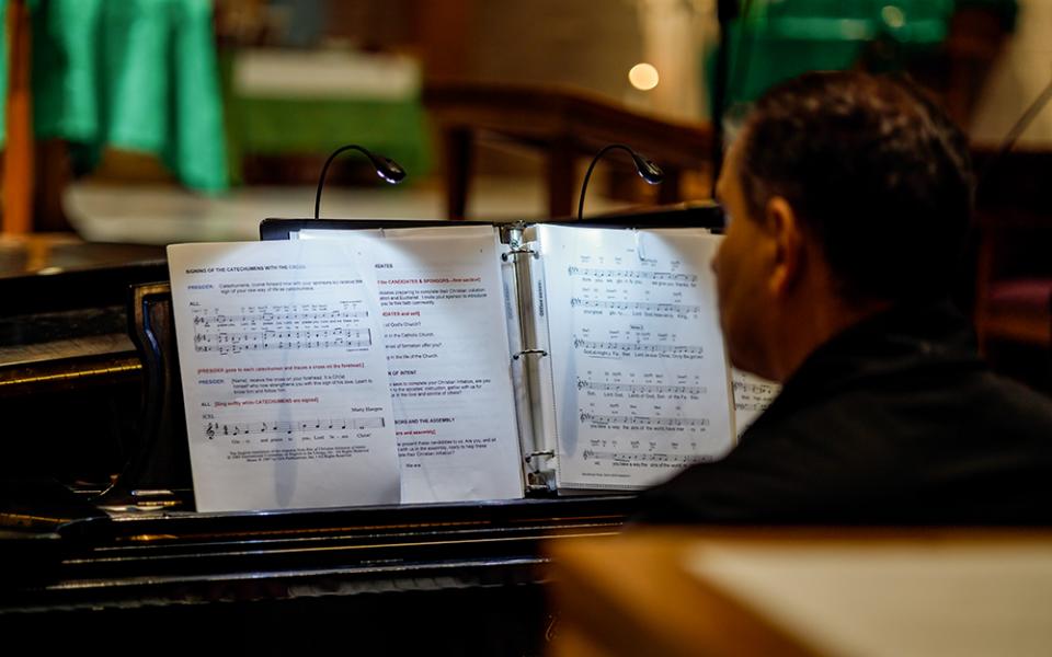A pianist plays during evening Mass at the St. Thomas More Newman Center in Columbia, Missouri, on Nov. 3. (Artem Baidala)
