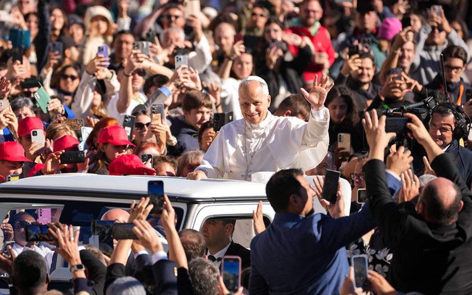 Pope Leo XIV greets visitors and pilgrims from the popemobile as he rides around St. Peter's Square at the Vatican before his weekly general audience Nov. 5, 2025. (CNS/Lola Gomez)