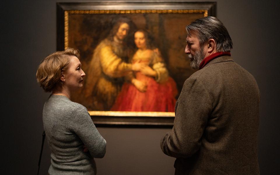 In a scene from the movie "Midwinter Break," Stella (Lesley Manville) and Gerry (Ciarán Hinds) survey "The Jewish Bride," a Rembrandt painting of Isaac and Rebecca that hangs in the Rijksmuseum, and see two separate but equally plausible meanings based on the circumstances of their own lives. (Focus Features/Mark de Blok)