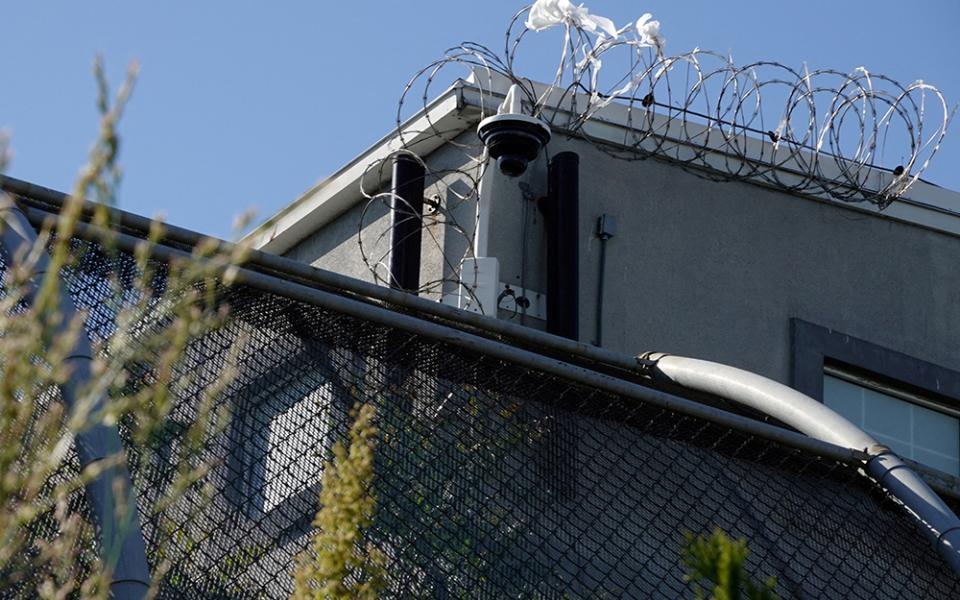 A surveillance camera sits outside of Delaney Hall, a 1,000-person detention center operated by private prison company GEO Group for Immigration and Customs Enforcement (ICE), in the Ironbound neighborhood of Newark, New Jersey, May 10, 2025. (OSV News/Reuters/Bing Guan)