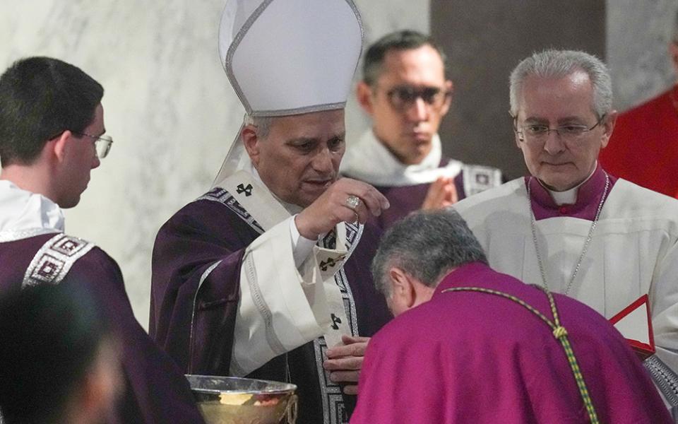 Pope Leo XIV sprinkles ashes during Ash Wednesday Mass at the Basilica of Santa Sabina in Rome Feb. 18, 2026. (CNS/Lola Gomez)