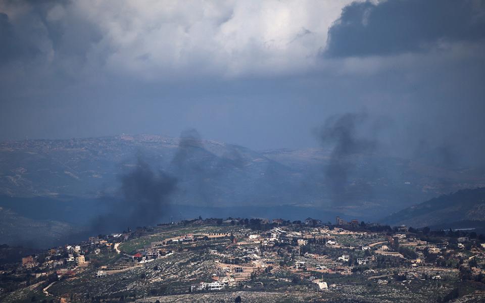 Smoke rises from a village in Lebanon as seen from northern Israel, March 16, 2026, following an Israeli airstrike, amid escalation in aerial attacks between Hezbollah and Israel as the U.S.-Israeli war with Iran continues. (OSV News/Reuters/Shir Torem)