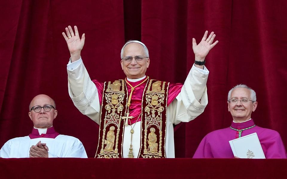 Pope Leo XIV, the former Cardinal Robert F. Prevost, waves to the crowds in St. Peter's Square at the Vatican after his election as pope May 8, 2025. (CNS/Lola Gomez)
