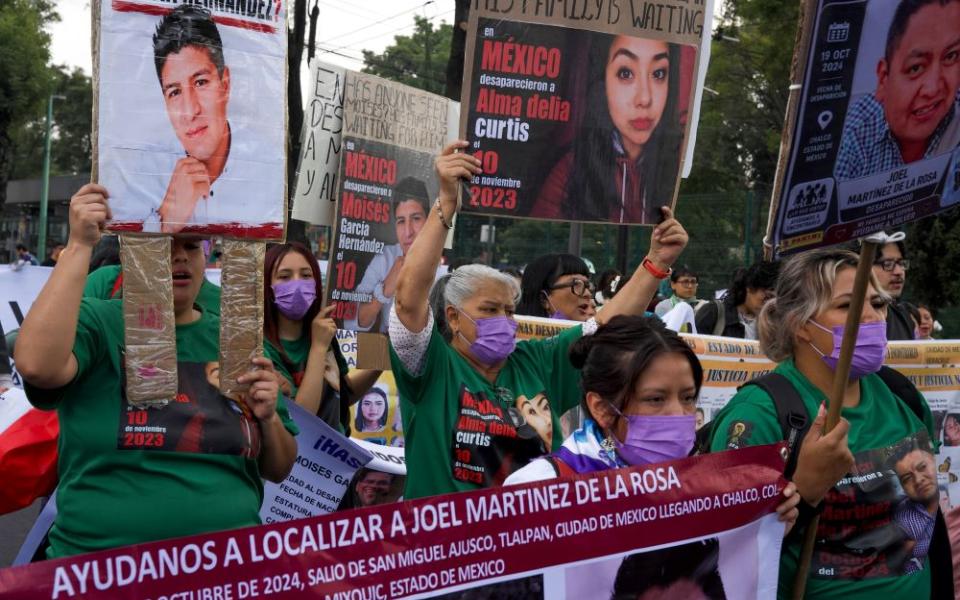 Relatives of Mexico's disappeared march before the opening day of the 2026 FIFA World Cup in Mexico City, Thursday, June 11, 2026. (AP/Alejandro Cegarra)