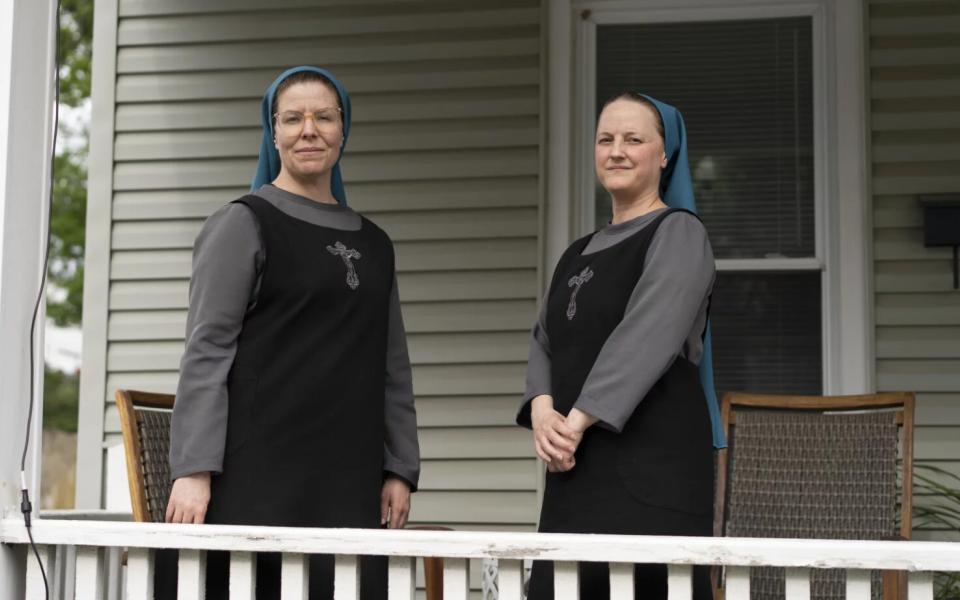 Sister Danielle Lussier, left, and Sister Theresa Aletheia pose for a portrait on the front porch of their home on April 27, 2026, in Mt. Sterling, Ky