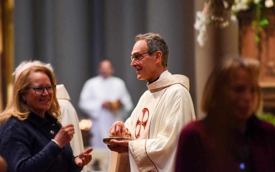 Jesuit Fr. Gregory Bonfiglio, pastor of St. Ignatius Parish in San Francisco, celebrates Mass in late April 2026. Bonfiglio wrote that the parish paying its assessment for the archdiocese's  settlement of clergy sex abuse cases was "an act of solidarity with survivors." (Courtesy St. Ignatius Parish)
