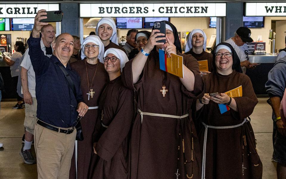 Nuns take a selfie ahead of a June 14, 2025, celebration in honor of Pope Leo XIV at Rate Field in Chicago, home of the Chicago White Sox baseball team. (OSV News/Reuters/Carlos Osorio)