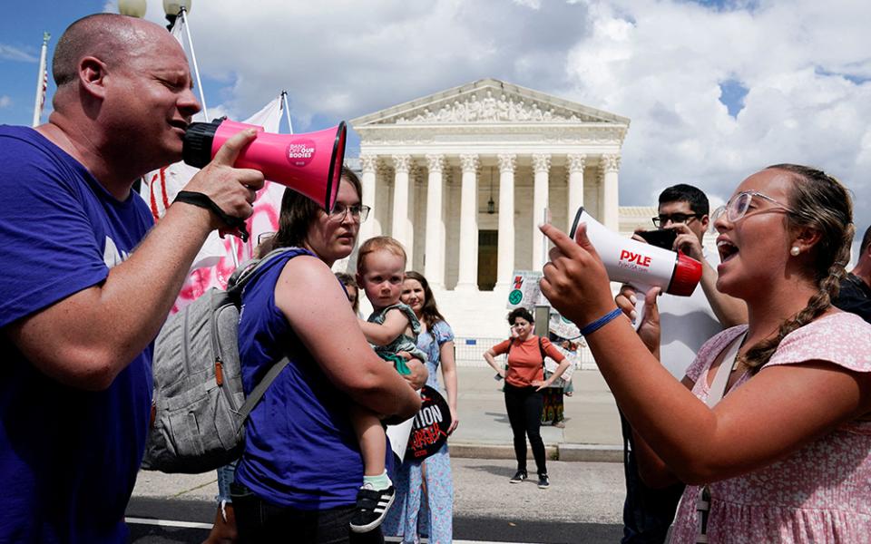 An anti-abortion activist and a supporter of legal abortion square off with megaphones in front of the U.S. Supreme Court in Washington June 24, 2023, the first anniversary the court's 2022 ruling in Dobbs v. Jackson Women's Health Organization. (OSV News/Reuters/Evelyn Hockstein)