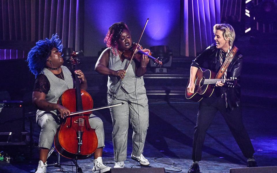 Brandi Carlile (right) performs with Monique Ross (far left) and Chauntee Ross of SistaStrings during the 55th annual Songwriters Hall of Fame Induction and Awards Gala at the Marriott Marquis Hotel on Thursday, June 11, 2026, in New York. (AP/Invision/Evan Agostini)