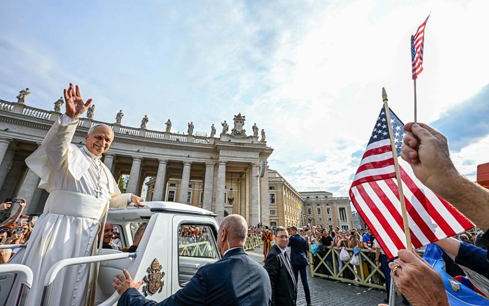 U.S. flags are seen among the crowd as Pope Leo XIV greets visitors and pilgrims from the popemobile while riding around St. Peter’s Square at the Vatican before his weekly general audience Oct. 7, 2026. (CNS/Vatican Media)