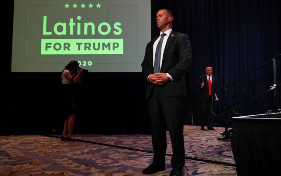 President Donald Trump, right, walks on stage before delivering remarks during a Latinos For Trump campaign event at the Trump National Doral Miami resort in Doral, Florida, Sept. 25, 2020. (CNS/Reuters/Tom Brenner)