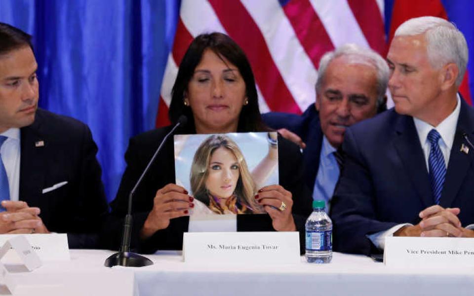 Sen. Marco Rubio, R-Florida, and Vice President Mike Pence listen to Maria Eugenia Tovar Aug. 23 at Our Lady of Guadalupe Church in Doral, Florida, as she holds a picture of her daughter who was killed in 2014 during a protest in Venezuela.