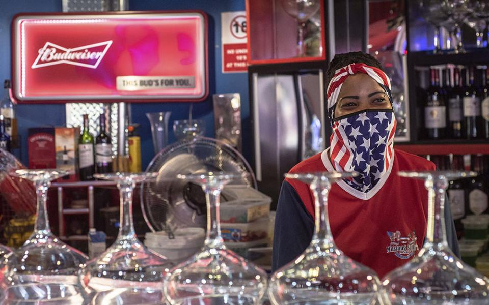 A bartender wears a face mask to protect against COVID-19 at the Mustang Sally Restaurant in Pretoria, South Africa, on Nov. 4, 2020, the day of the U.S. presidential election. (AP)