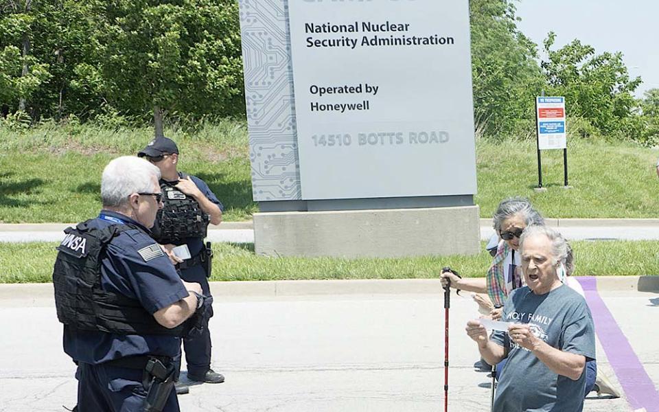 Moments after Tom and Hoa Fox crossed a purple line marking a private entrance to the Kansas City, Missouri, nuclear weapons manufacturing plant, called a "National Security Campus," police moved in to detain them. (Courtesy of Jeff Davis)