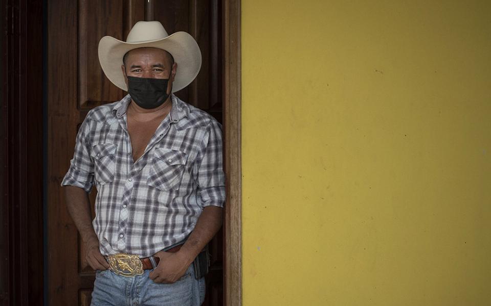 Freddy Murio at the doorway to his home in Yorito, Honduras. After 12 years as an undocumented immigrant in New York, Murio is now running for mayor of his hometown, hoping to address the ills driving an exodus from the country. (Manuel Ortiz Escámez)
