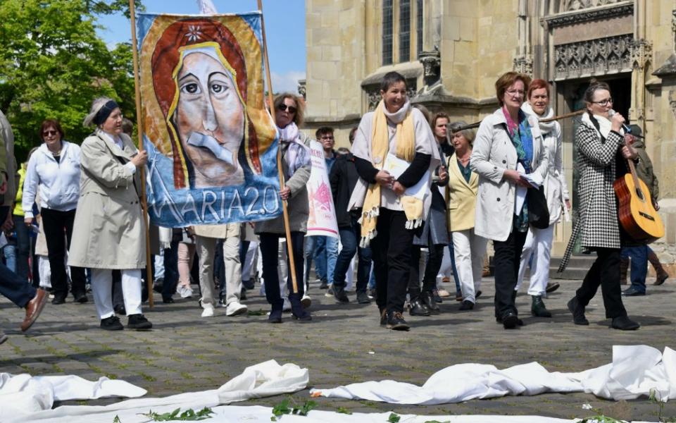 People in the Maria 2.0 movement protest outside Holy Cross Church in Münster, Germany, in May. (Ruth Koch)