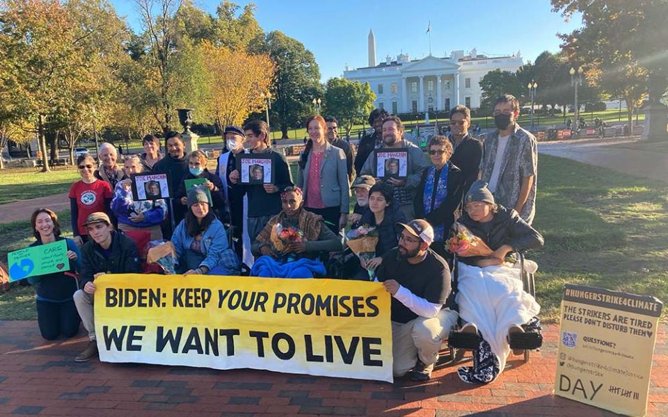 Participants in the All Saints' Day solidarity fast organized by Catholic Climate Covenant and the Ignatian Solidarity Network visit climate hunger strikers outside the White House in Washington, D.C. (Courtesy of Josh Burg)