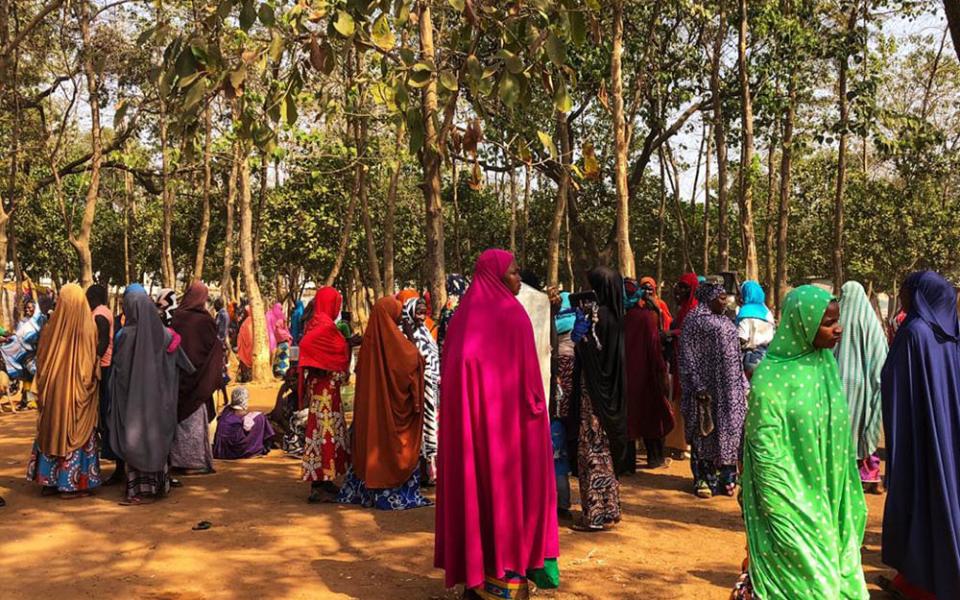 A group of women gather outside Area 1 IDP Camp for internally displaced persons in Abuja, Nigeria. (Chinedu Asadu)