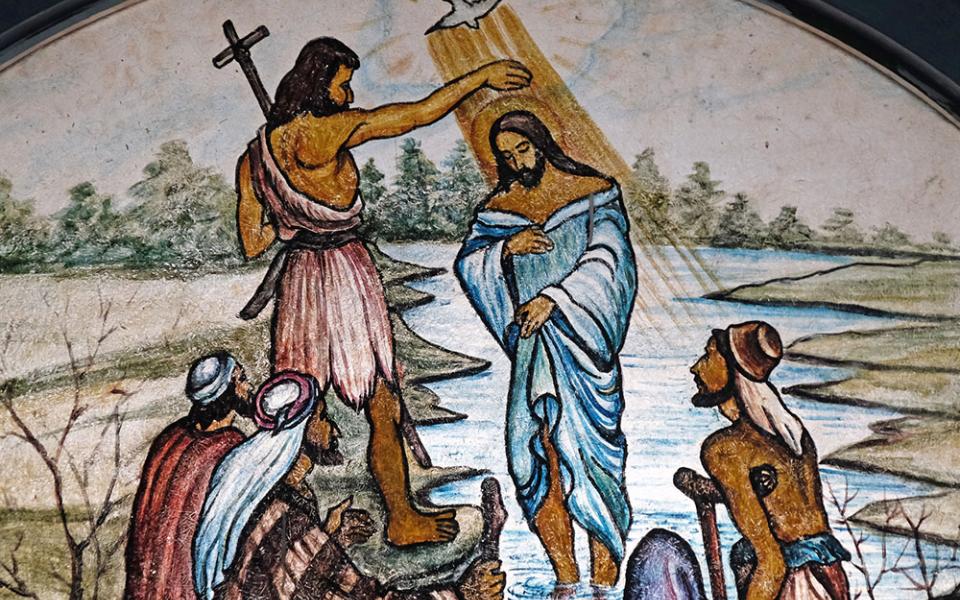 The baptism of the Lord is depicted in stained glass at the Cathedral of Immaculate Heart of Mary and St. Teresa of Calcutta in Baruipur, West Bengal, India. (Dreamstime/Zatletic)