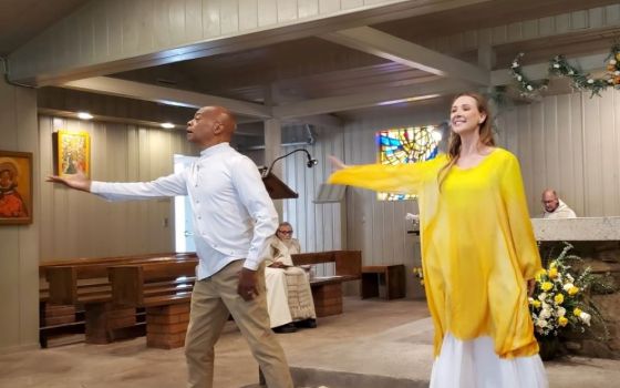 John West and Hilary Van Dixhorn lead the response to Psalm 149-150. Between them can be seen 93-year-old Fr. Philip Edwards, who has encouraged danced prayer.