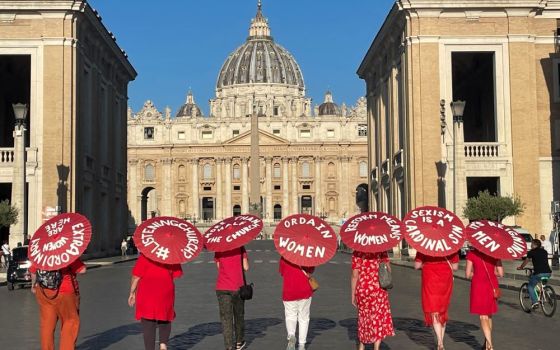 Women's ordination advocates walk toward St. Peter's Square as part of a witness on Aug. 29. The author notes that women's issues in the church is showing up in national synod syntheses from all over the world.
