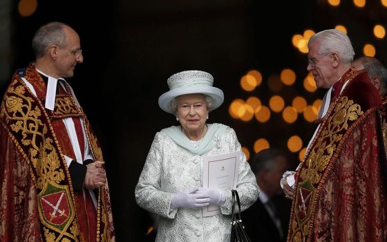 Britain's Queen Elizabeth II smiles as she leaves St. Paul's Cathedral in London with the Revs. David Ison and Michael Colclough following a thanksgiving service to mark her diamond jubilee in London June 5, 2012. (CNS/Reuters/Andrew Winning)