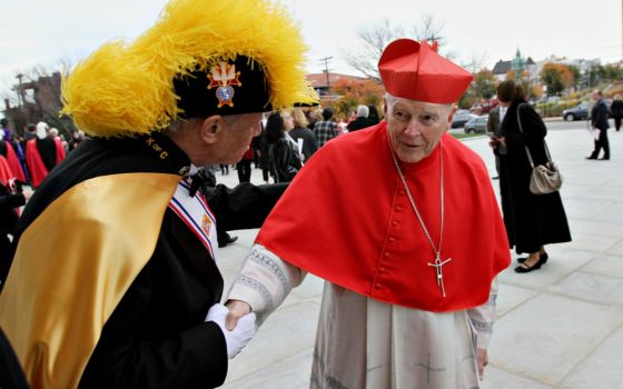 A Knight of Columbus greets then-Cardinal Theodore McCarrick, retired archbishop of Washington, at the Cathedral Basilica of the Sacred Heart in Newark, New Jersey, in 2013. (CNS/Gregory A. Shemitz)
