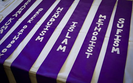 The names of different religions are lined up near a registration table for the annual Unity Walk Sept. 21, 2014, in Washington. (CNS/Tyler Orburn)