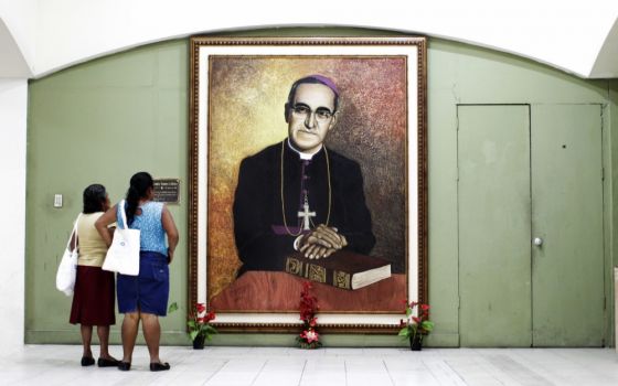 People look at a painting of slain Salvadoran Archbishop Óscar Romero at the cathedral in San Salvador in 2015. (CNS/Reuters/Jose Cabezas)
