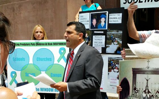 State Rep. Mark Rozzi, alongside sex abuse survivors and victim-rights advocates, holds a press conference outside the Cathedral Basilica of Sts. Peter and Paul in Philadelphia in July 2016. (NCR photo/Elizabeth Eisenstadt Evans)
