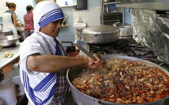 Sr. Marie Frank, a member of the Missionaries of Charity, prepares lunch in a soup kitchen run by her order in an apartment building in the South Bronx section of New York in this 2016 photo. (CNS/Gregory A. Shemitz) 