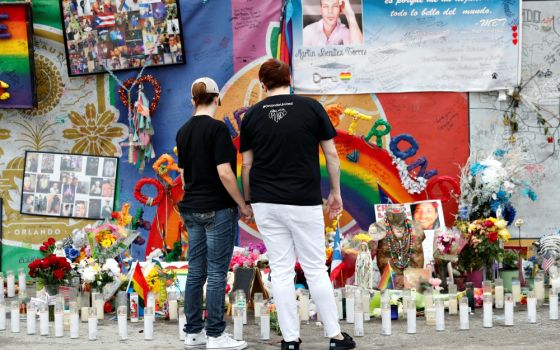 People visit the memorial outside the Pulse nightclub in Orlando, Florida, June 12, 2017, the one-year anniversary of the mass shooting there. (CNS/Reuters/Scott Audette)