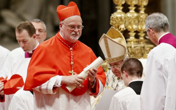 Cardinal Anders Arborelius of Stockholm carries his scroll after being made a cardinal by Pope Francis during a consistory in St. Peter's Basilica at the Vatican June 28. (CNS/Paul Haring)