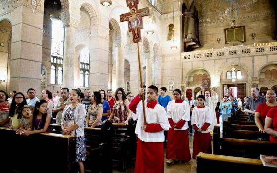 Catholics at the Shrine of the Sacred Heart in Washington, D.C., attend Mass for the feast of the Assumption Aug. 15. (CNS/Rhina Guidos)