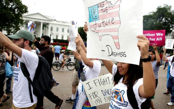 People march outside the White House Aug. 15 at a rally calling on President Donald Trump to protect the Deferred Action for Childhood Arrivals program, known as DACA. (CNS/Reuters/Joshua Roberts)