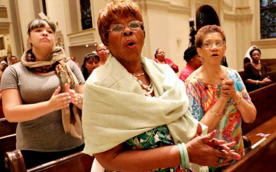 Women sing during a Mass for solidarity and peace Aug. 24, 2017, at St. James Cathedral Basilica in Brooklyn, New York. (CNS/Gregory A. Shemitz)