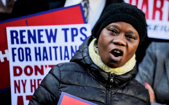 A woman participates in an immigration rally for Haitians Nov. 21 in New York City. (CNS/Reuters/Eduardo Munoz)
