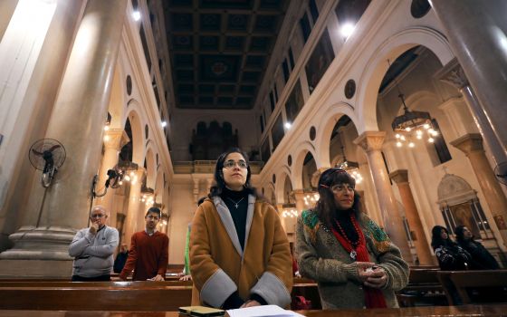 Worshippers pray during Mass on New Year's Eve at St. Joseph's Catholic Church in Cairo. (CNS photo/Mohamed Abd El Ghany, Reuters)