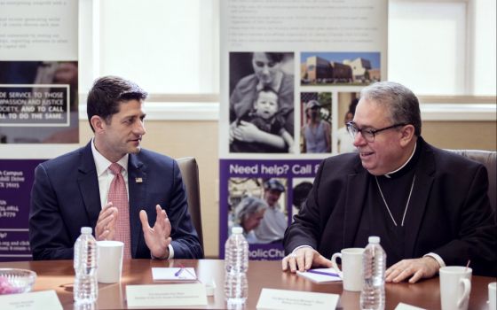 House Speaker Paul Ryan, R-Wisconsin, visits with Bishop Michael Olson of Fort Worth, Texas, during a private roundtable discussion on poverty-fighting efforts at Catholic Charities April 3. (CNS/North Texas Catholic Magazine/Juan Guajardo)