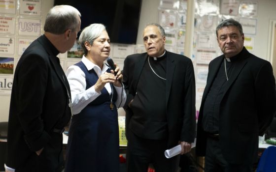 Sr. Norma Pimentel, executive director of Catholic Charities of the Rio Grande Valley in Texas, speaks to an audience July 1 as she shows a delegation of U.S. bishops a respite center for new immigrant arrivals in McAllen, Texas. (CNS/Chaz Muth)