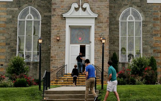 Massgoers enter Immaculate Heart of Mary Church Aug. 19 in Abbottstown, Pennsylvania, which is in the Diocese of Harrisburg. (CNS/Bob Roller)